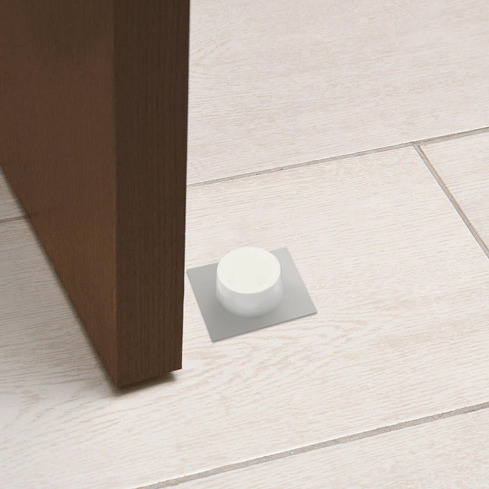 Tope puerta - Base adhesiva. - Color blanco. - Placa metalica. muestra